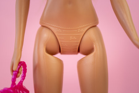 October 9, 2023. Barnaul, Russia: Barbie doll with loose blond hair on a blue background. inscription on the mattel on of the plastic dollのeditorial素材