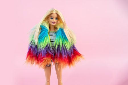 October 9, 2023. Barnaul, Russia: Barbie doll with loose blond hair standing on a pink background.のeditorial素材