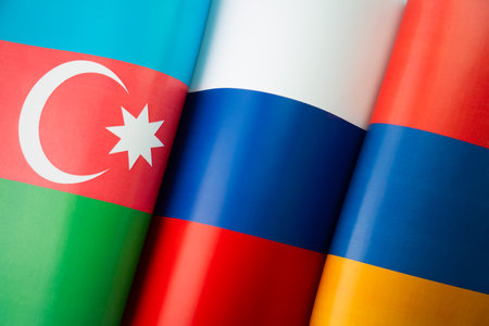 Background of the flags of the azerbaijan, russia, armenia. The concept of interaction or counteraction between the countries. International relations. Collective Security Treaty Organizationの写真素材