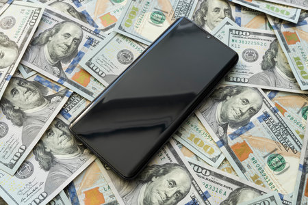 smartphone screen on US dollar banknotes background for design purpose. a blank screen on a...