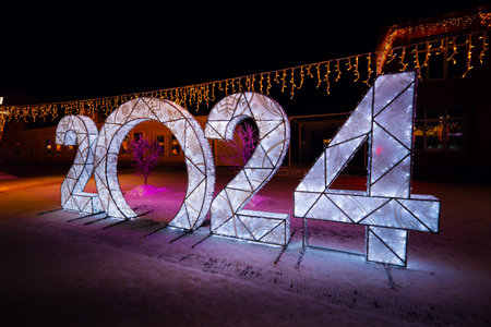 Happy New Year 2024. Sparkling burning numbers Year 2022 with on black background. Beautiful design element. christmas street decorations. snowfall movement effectの写真素材