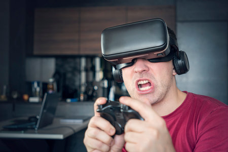 man gamer fun playing on futuristic simulation video shooting explore game in 3d glasses and...
