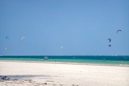 man is kitesurfing in the Caribbean sea in Diani Beach, Kenya, Mombasa.の写真素材