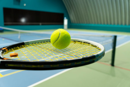 Tennis ball and racket on the court. playing tennis, training in the tennis hall