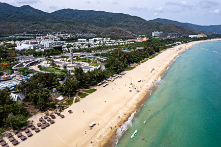 perspective coastline around blue sea under sunny blue cloudy sky. At Yalong Bay in Sanya Hainan China. wide angle.の写真素材