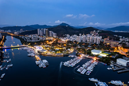Aerial top view of white luxury yachts moored neatly in harbor port