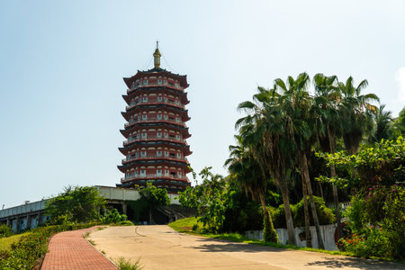 Duobao Stupa and palm tree in Nanshan, Hainan, Chinaの写真素材