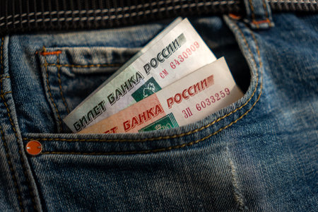 Russian Rubles in the Pocket of the Jeans closeup. pocket money. A small loan.