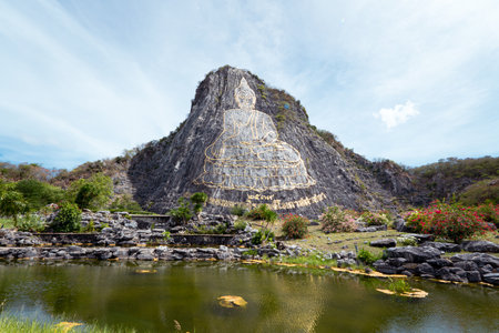 Buddha image created by laser at Khao Chi Chan Mountain, Pattaya. Chonburi, Thailand. Religious attractions in the vicinity of Pattayaの写真素材