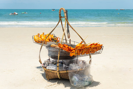 Thailand Koh Samet: Traditional Thai chicken barbecue cooking street food at the beachの写真素材