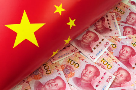 Money, currency of PBOC or people's bank of china. One hundred CNY Chinese yuan bill with a flag of China. 100 rmb or renminbi, depicts Beijing economy system, public banking policy and interest rateの写真素材