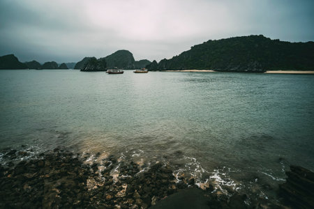 rocky shore against the beautiful sea landscape of Halong Bay.の写真素材