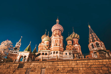 Close up of beautiful colorful houses of St. Basil cathedral in Red Square in Moscow, Russia. Patterned houses of Russian orthodox church rise above brick base in twilight. Architecture masterpieceの写真素材