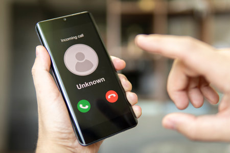 Man answering to incoming call. Hoax person with fake identity. Phone call from unknown number. Scam, fraud or phishing with smartphone concept. Prank caller, scammer or stranger.の写真素材