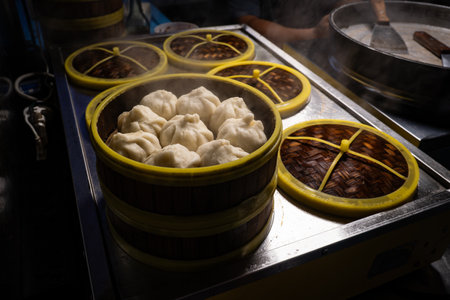 Bamboo steamer with baozi. Chinese stuffed steamed buns. Inside restaurant kitchen. bun Pao-tsih. Bao.の写真素材