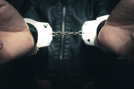 prisoner concept,Handcuffed hand of a prisoner in prison, Male prisoners were severely strained in...