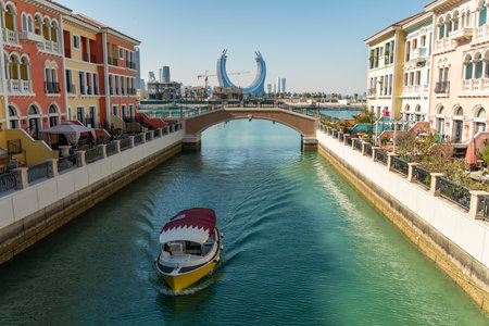 District Little Venice. Beautiful Venetian-style houses and water channels between the houses and bridges over the river. modern European architecture. Qatar. Doha Qanat Quartierの写真素材