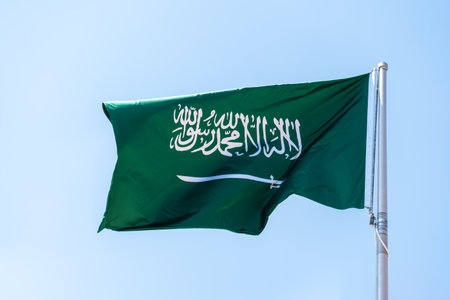 Saudi Arabia national flag fluttering. The flag blowing in beautiful soft sky. Saudi Arabian national flag for independence day.の写真素材