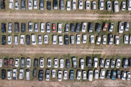 car parking in a field outside the city.. view to carefully parked ranks of cars. Car navigation in...