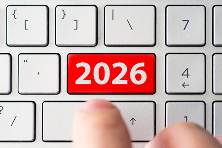 Close-up of a finger pressing a button labeled 2026, symbolizing the start of a new year, innovation, technology, future plans, and new opportunities ahead.の写真素材