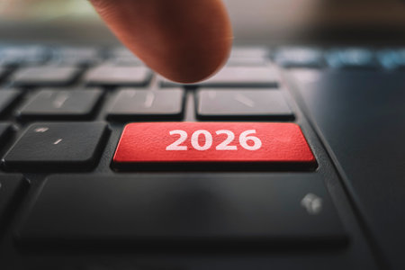 Keyboard with text 2026 year and finger pushing the enter button. Red Color button on the black keyboard of modern ultrabook. caption on the button.の写真素材