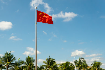 view of Chinese flag on sky background.の写真素材