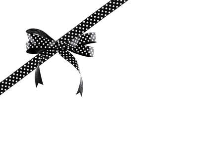 Black and white ribbon with a bow on a white backgroundの写真素材