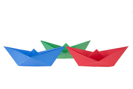 isolated in white boats made of folded colored paperの写真素材