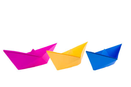 isolated in white boats made of folded colored paper