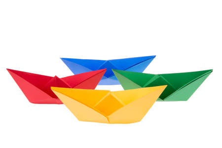 isolated in white boats made of folded colored paperの写真素材