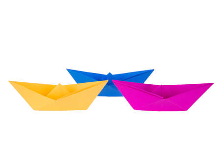 isolated in white boats made of folded colored paperの写真素材
