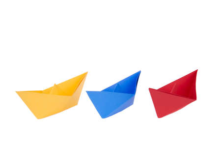 isolated in white boats made of folded colored paperの写真素材