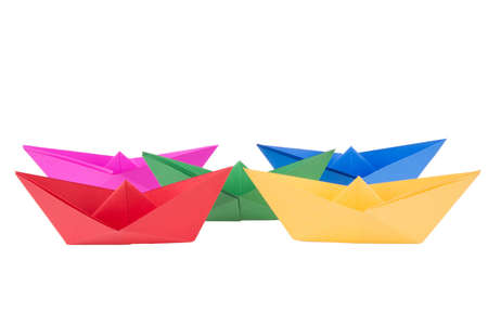 isolated in white boats made of folded colored paperの写真素材