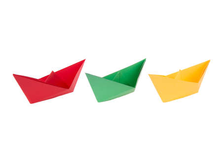 isolated in white boats made of folded colored paperの写真素材