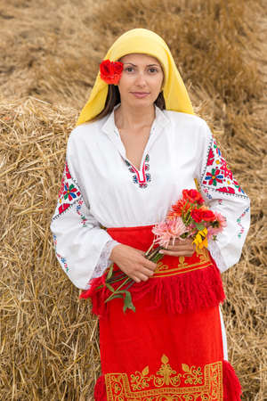Young woman with national costume from Bulgaria