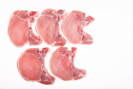 raw pork on a white backgroundの写真素材
