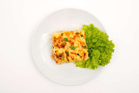Moussaka. Top view. Selective focus White background.
