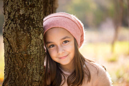 Adorable little girl outdoors at beautiful autumn dayの写真素材
