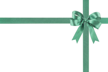 Green ribbon with a bow on white backgroundの写真素材