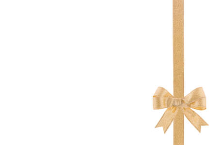Golden ribbon with a bow on white backgroundの写真素材