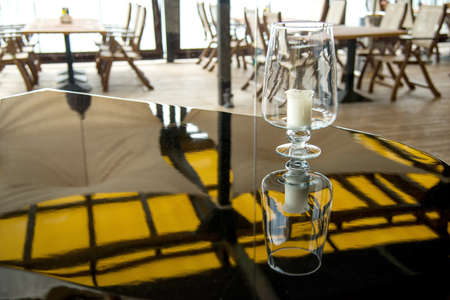 candle on a grand piano in a restaurant - selective focus, copy space