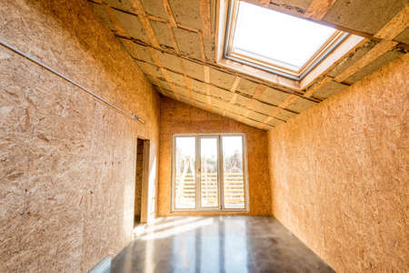 Wooden frame of a new house under constructionの写真素材