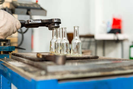glass bottle production factory - machine blowing of glassの写真素材