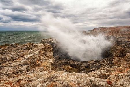 Dramatic seascape with rocks and wavesの写真素材