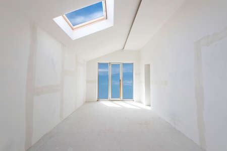 Unfinished building interior, white room with sky view (includes clipping path)の写真素材
