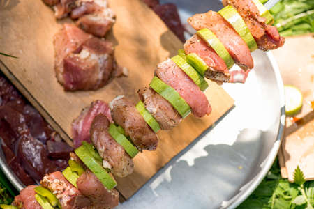 Preparation of meat skewers for barbeque - selective focus, copy spaceの写真素材