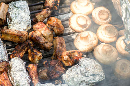 Fresh meat and vegetables preparing on grill - selective focus, copy spaceの写真素材