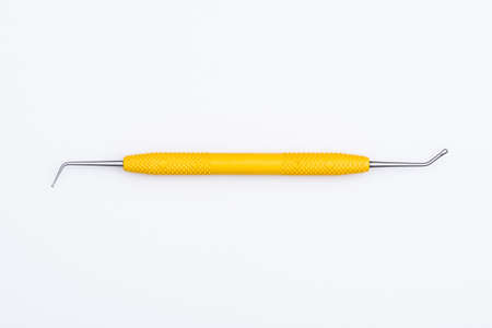 Dental tools on a white background - copy spaceの写真素材