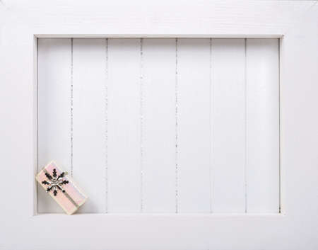 White wooden frame and  christmas decoration over white background - copy spaceの写真素材