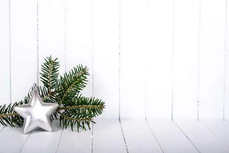 Christmas decoration with fir branches on white striped background - selective focus, copy spaceの写真素材